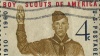 A stamp of a boy scout taking an oath.