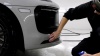 a tech preparing a sports car for ceramic coating installation