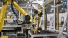 Cap and Bung Machine Tending and Assembly for Automotive Manufacturing