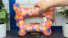 Show in main carousel: Huxley & Kent Dog Power Plush Party Time Bone Pink Dog Toy, Pink, Small slide 10 of 10